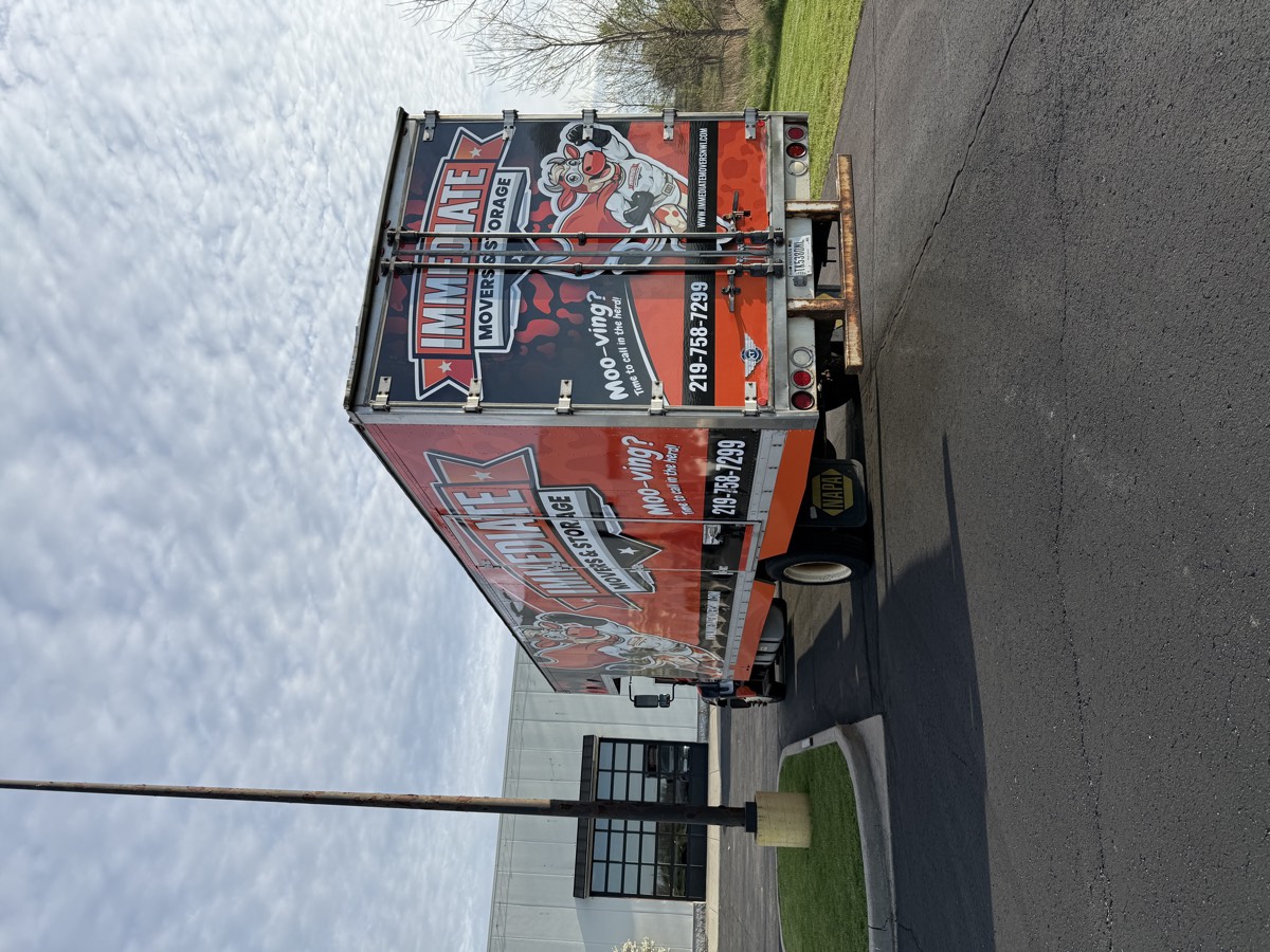 Bold red box truck wrap for Immediate Movers & Storage.
