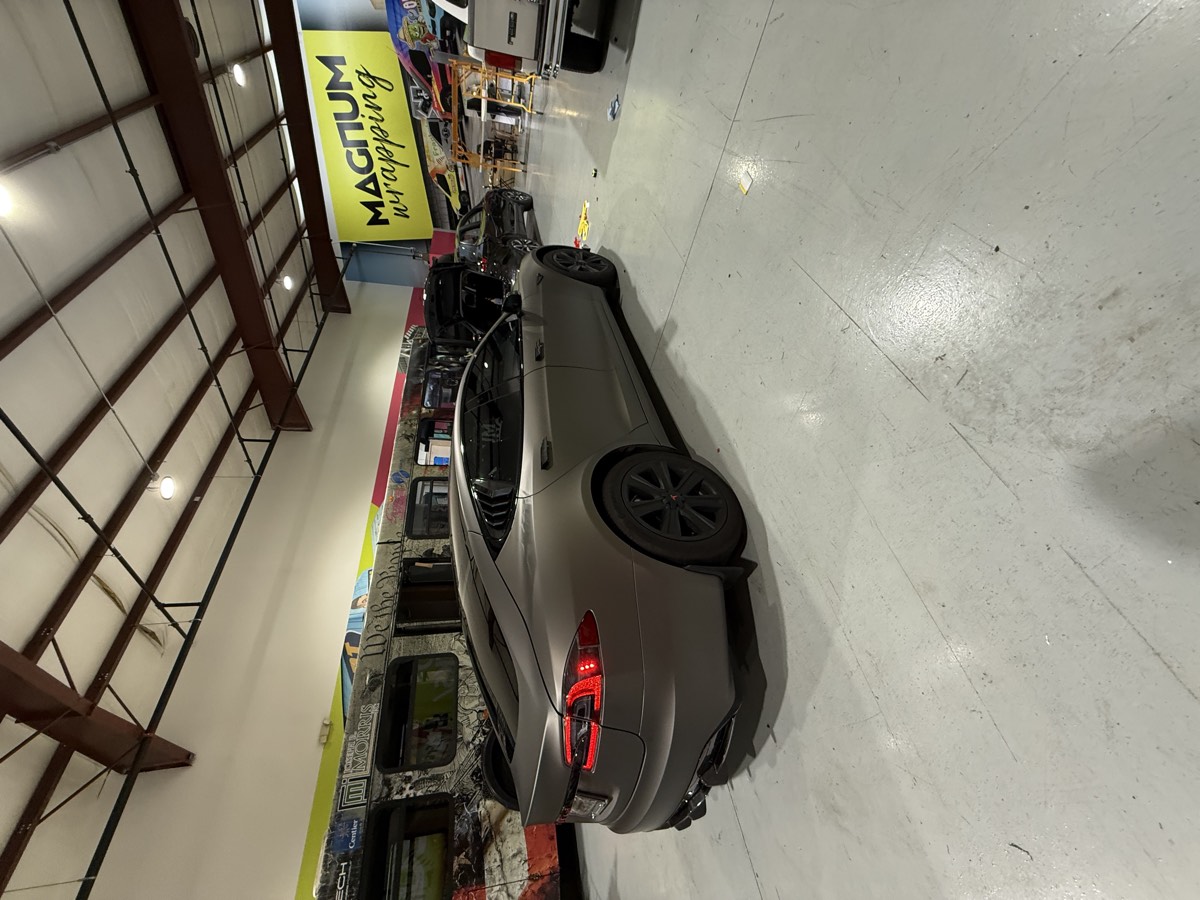 Matte metallic color-change wrap on a Tesla.