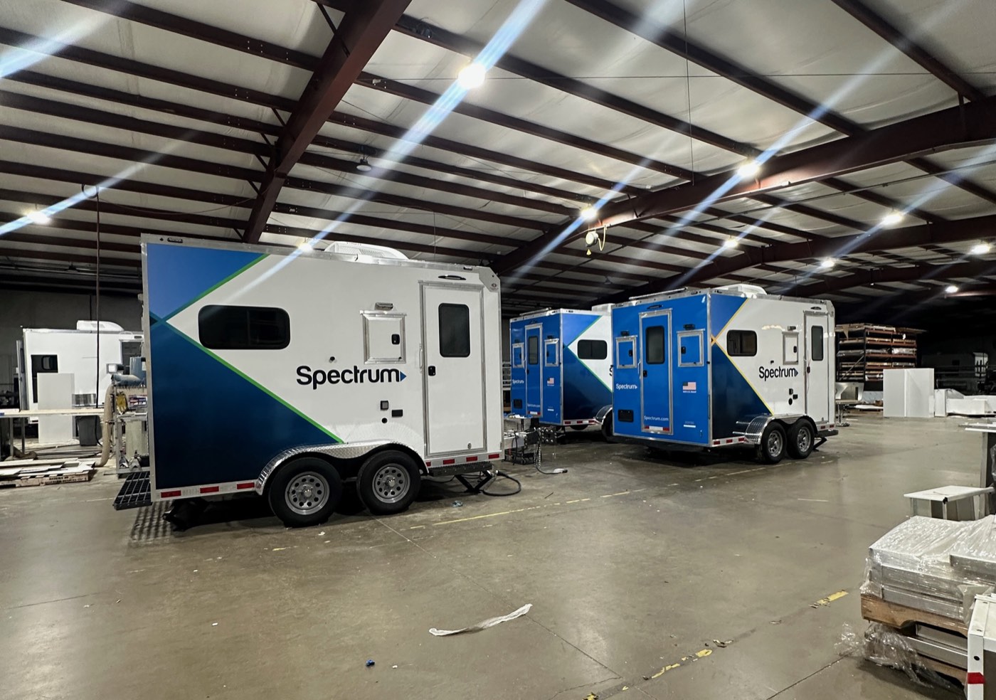 Spectrum enclosed trailer fleet wrapped for Charter Communications.