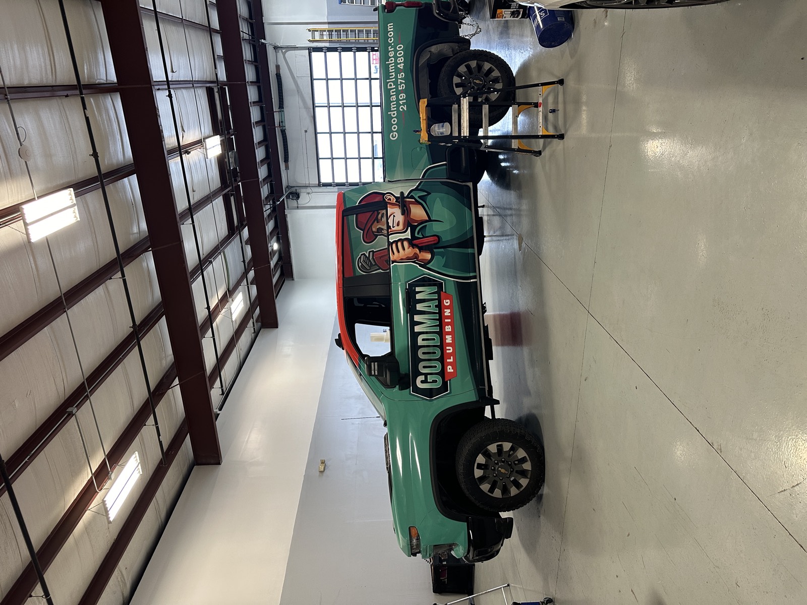 Teal and red full wrap on a Goodman Plumbing pickup