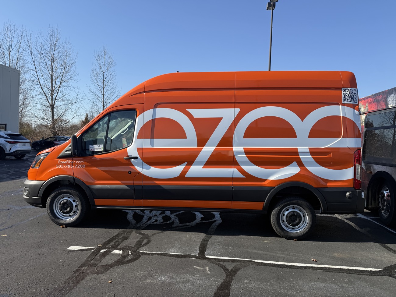 Full orange wrap on an Ezee Fiber cargo van.